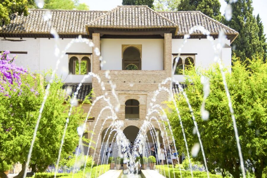 Granada: Alhambra, Nasrid, and Generalife Private Tour - Entering the Alhambra complex with skip-the-line tickets